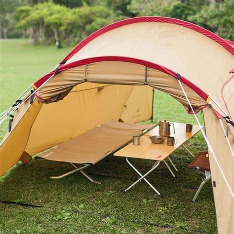 The Amenity Dome Small in Ivory features an outer vestibule, a removable rainfly, ample ventilation, color-coordinated pieces for simple set-up, and side pockets for storage. . Snow peak vault dome tent